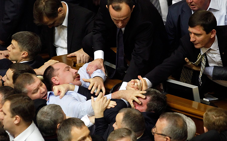 Ukraine fight: Lawmakers scuffle during a session at the Ukrainian parliament