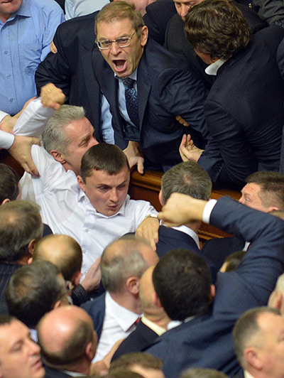 Ukraine fight: Lawmakers scuffle during a session at the Ukrainian parliament