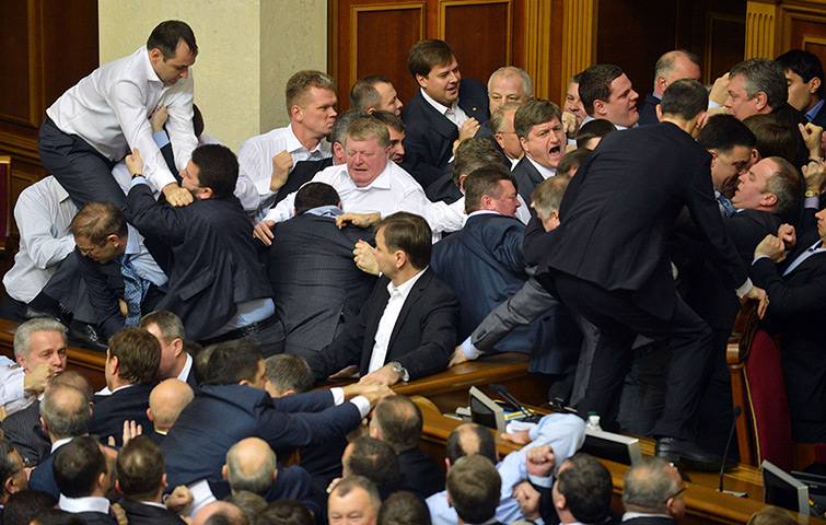 Ukraine fight: Lawmakers scuffle during a session at the Ukrainian parliament