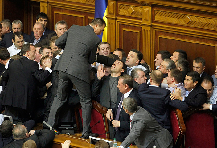 Ukraine fight: Lawmakers scuffle during a session at the Ukrainian parliament