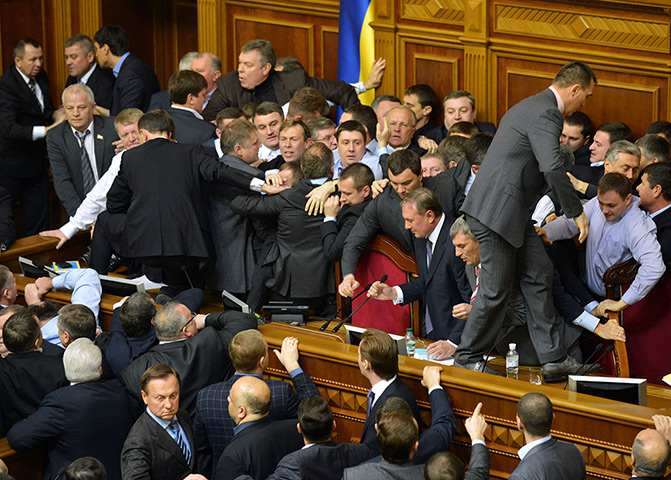 Ukraine fight: Lawmakers scuffle during a session at the Ukrainian parliament