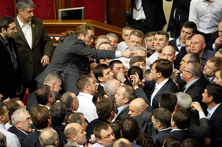 Ukraine fight: Lawmakers scuffle during a session at the Ukrainian parliament