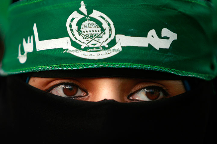 20 Photos: A Palestinian supporter of Hamas celebrating their 25th anniversary 