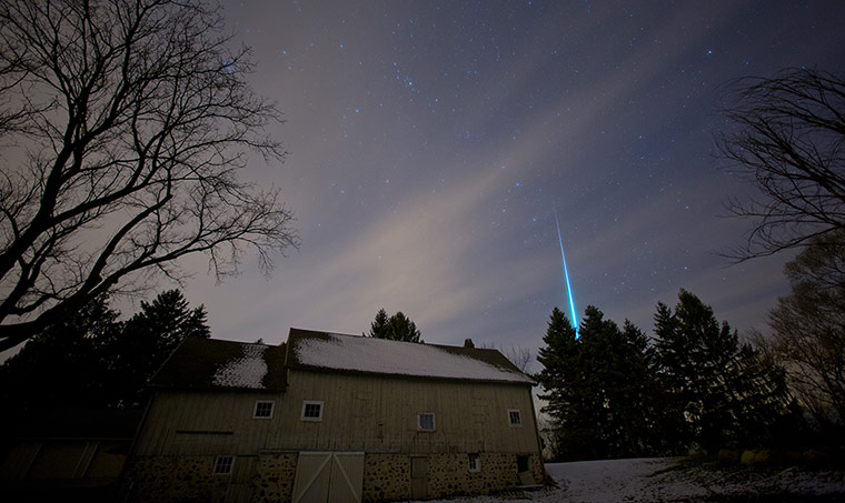 24 hours: A Geminid meteor streaks over a barn in Saukville, Wisconsin, USA