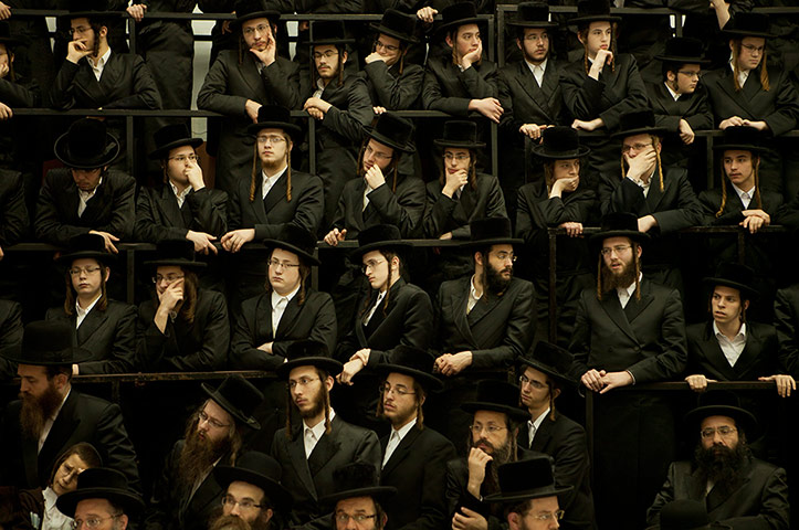 20 Photos: Ultra Orthodox Jewish men at a celebration of Hanukkah in Bnei Brak