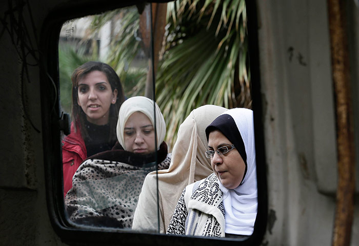 Egypt Referendum: Egyptian women wait outside a polling station to cast their votes