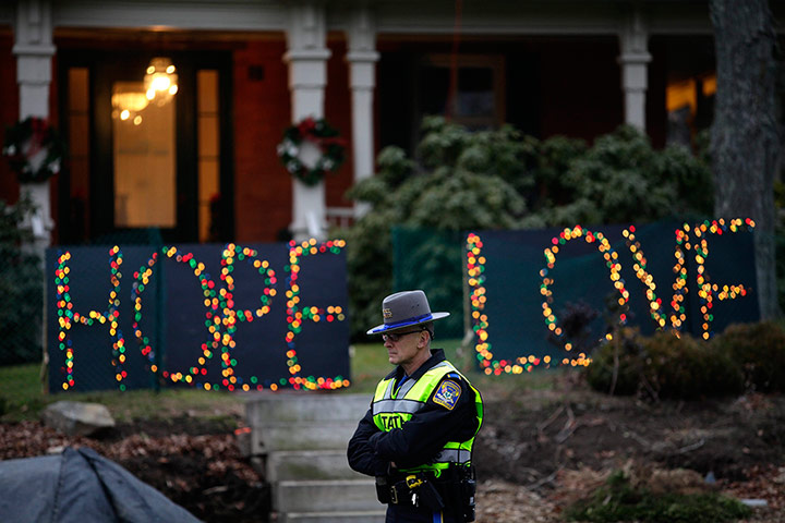 Sandy Hook: A Connecticut State Police Officer stands at an intersection in Newtown