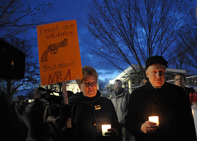 Sandy Hook: Gun control supporters take part in a candlelight vigil at Lafayette Square
