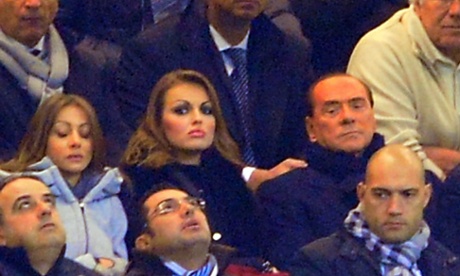 In this picture taken on December 4, 2012 AC Milan's president Silvio Berlusconi (R) sits with his new girlfriend Francesca Pascale (L) during  the Champions League match AC Milan vs  FC Zenith at the at San Siro Stadium in Milan.