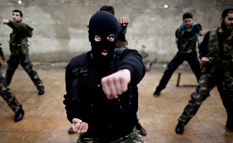 24 hours in pictures: Syrian rebels attend a training session in Maaret Ikhwan