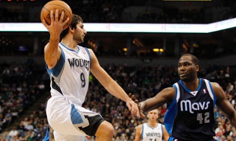 Minnesota Timberwolves point guard Ricky Rubio (9), of Spain, passes the ball around Dallas Mavericks power forward Elton Brand (42) during the first half on an NBA basketball game on Saturday, Dec. 15, 2012, in Minneapolis. Rubio is making his season debut after recovering from surgery on his left knee. (AP Photo/Genevieve Ross)