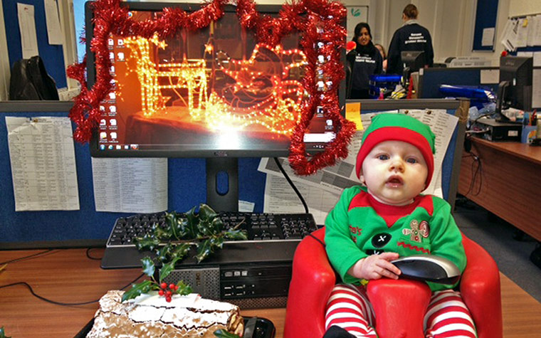 deckyourdesk: Baby in elf costume by computer
