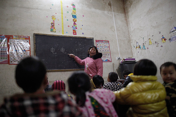 FTA: Aly Song: A teacher teaches children Chinese characters during a class 