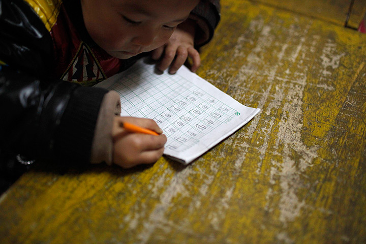 FTA: Aly Song: A child writes Chinese characters during a class at a kindergarten