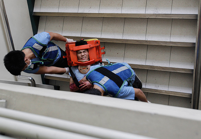 24 hours in pictures: A student playing a role as an injured victim during a drill 