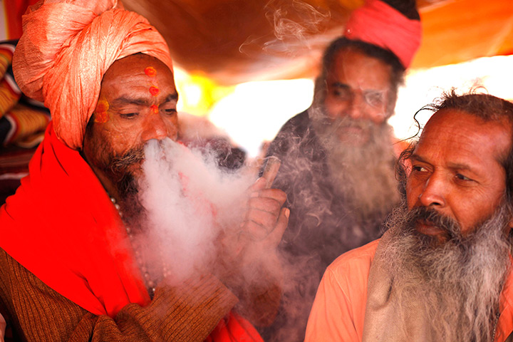 Lighter look: A Sadhu smokes marijuana in Allahabad, India