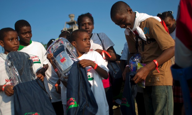 Children hold toys during a Christmas gift distribution event at the national palace in Port-au-Prince, Haiti.