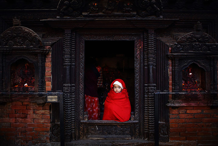 20 Photos: A girl looks out from a temple