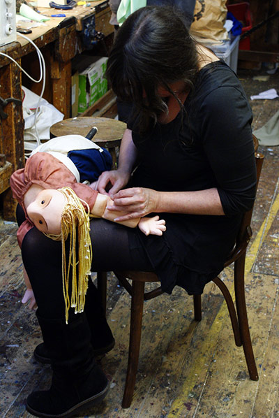 Little Angel: A puppet maker sewing on foam 