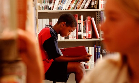 Boy reading in a library