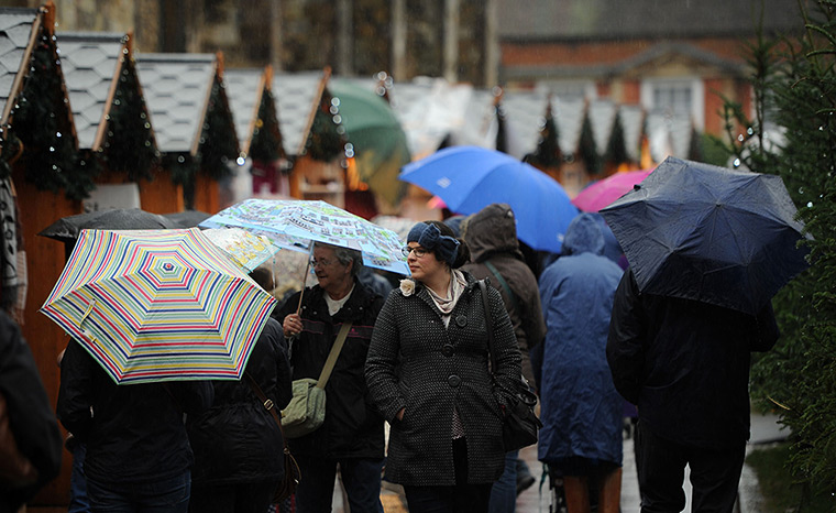 Wet weather: Shoppers in Winchester brave the weather as they shop 