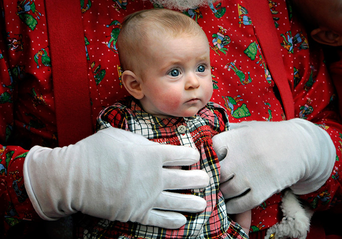 24 hours: St. Cloud, Minnestoa, US: Ada Huberty is held by Santa Claus