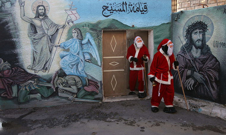 24 hours: Abud, West Bank: Men dressed as Santa Claus