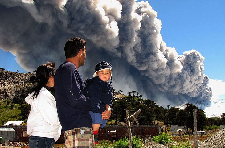 24 hours: Caviahue, Argentina: A family watches the Copahue volcano