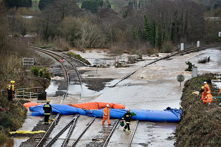 Wet weather: Railway engineers monitor the inflatable dams on the railway, Cowley Bridge