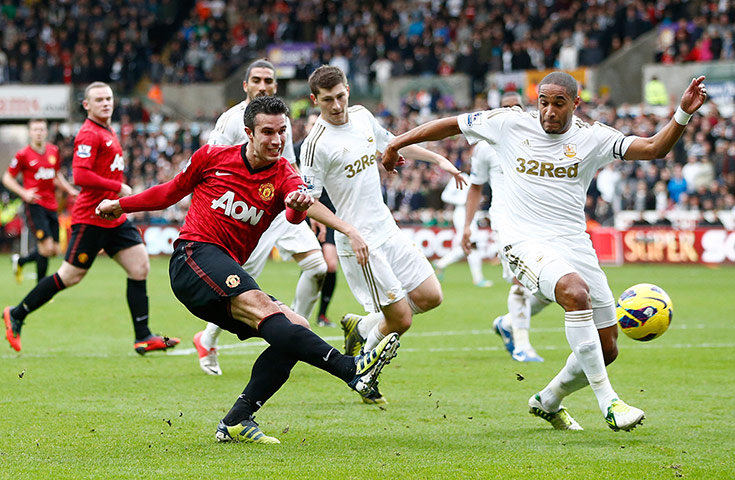 Sunday Action Roundup: Manchester United's Robin van Persie shoots at goal past Ashley Williams