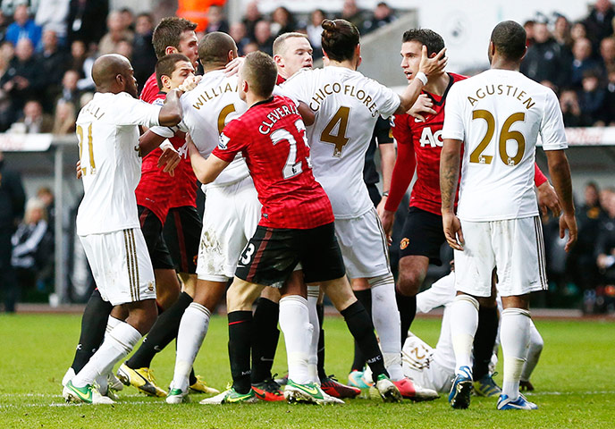 Sunday Action Roundup: United's Robin van Persie and Swansea City's Ashley Williams clash 