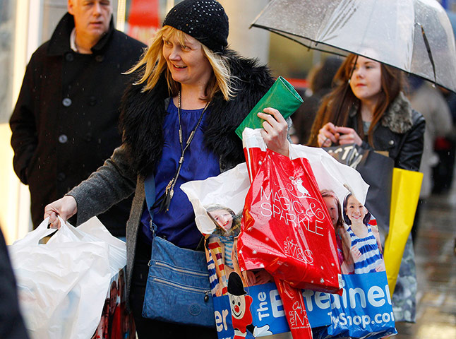 24 hours in pictures: A woman carries her bags