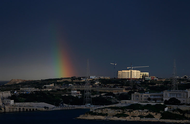 20 Photos: A rainbow forms after a rain storm next to SmartCity Malta in Valletta