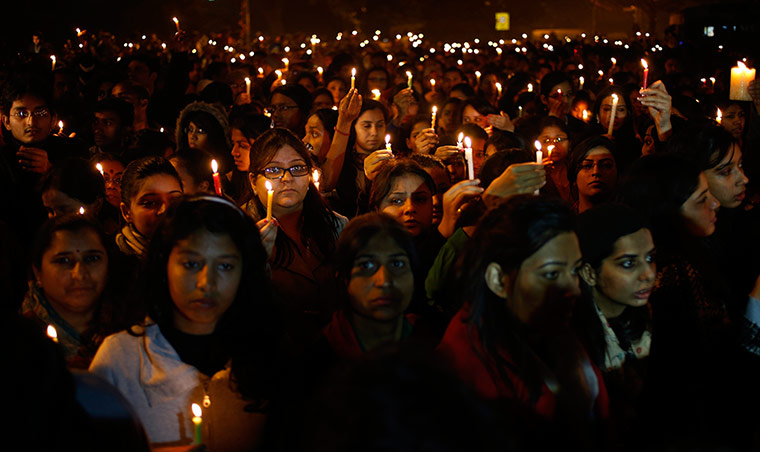 India: People hold candles as they mourn the death of a gang rape victim