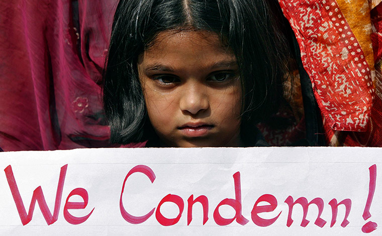 India: Girl holds a placard as she takes part in a protest rally in Hyderabad