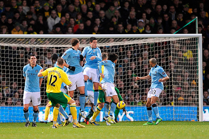 Saturday Sport Pictures: Anthony Pilkington shoots to score his team's opening goal from a free-kick