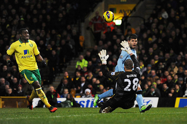 Saturday Sport Pictures: Sergio Aguero scores Manchester City's third goal past Norwich's Mark Bunn