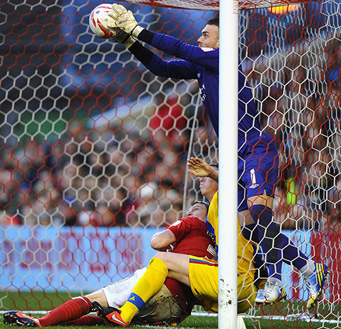 Saturday Sport Pictures: Lee Camp of Nottingham Forest saves on the line from Peter Ramage
