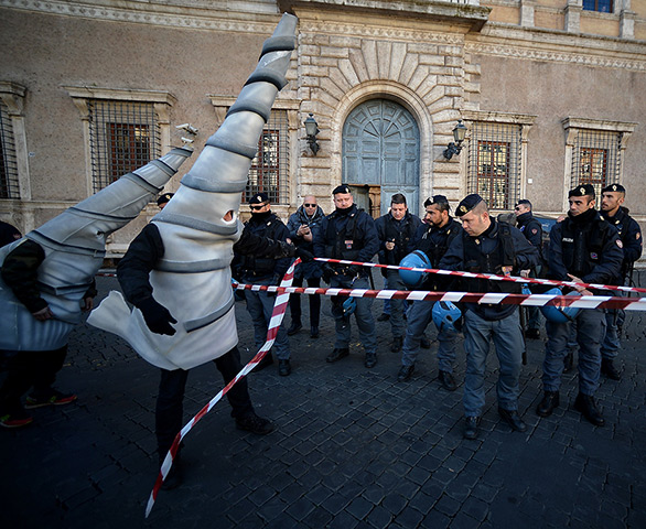 24 hours in pictures: People dressed as drills protest against