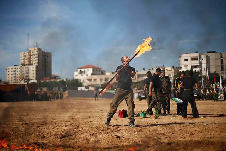 24 hours in pictures: A member of Hamas' national security forces demonstrates his skills