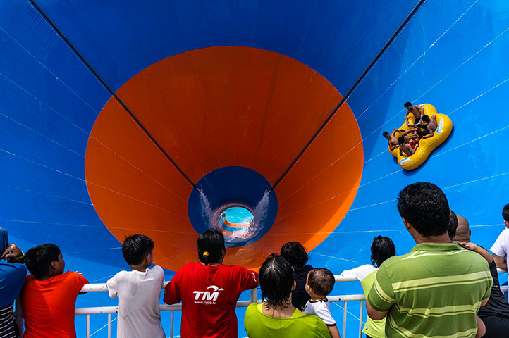 24 hours: A four man raft hurtles down the 46.6 metre Tornado water slide