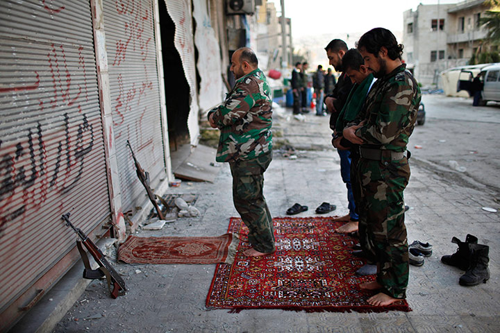 24 hours: Free Syrian army fighters pray at the front line
