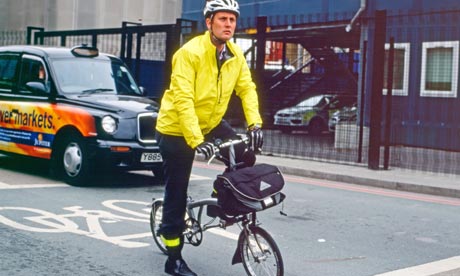 A businessman cycling to work in London 