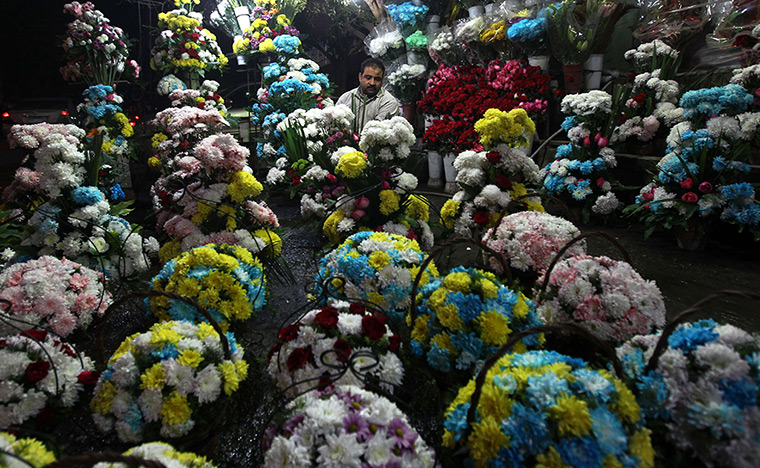 24 hours: Cairo, Egypt: Bouquets of flowers are prepared for sale 