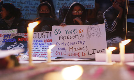 Indian protesters hold placards