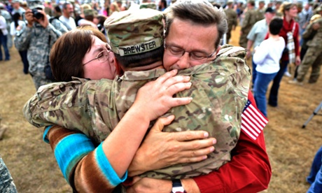 US Army Sergeant Aaron Brewster is welcomed home by his parents during a ceremony in Fort Stewart, Georgia. Around 200 soldiers with the 3rd Infantry Division's 1st Battalion, 64th Armor Regiment, 2nd Armored Brigade Combat Team returned home from their 9-month deployment to Afghanistan.