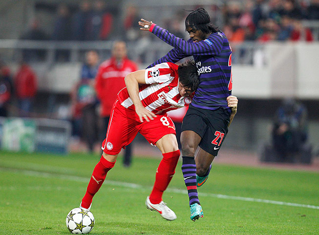 tuesday matchday 6 4: Arsenal's Gervinho in action with Olympiakos' Ljubomir Fejsa