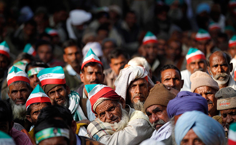 24 hours: New Delhi, India: Indian sugarcane farmers listen to a speaker