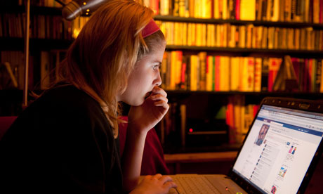 A teenage girl on a laptop