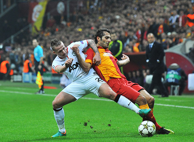 qualifiers: Manchester United's Tom Cleverley vies with Galatasaray's Hamit Altintop 